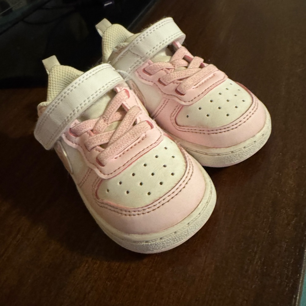 Pink and white toddler Nike dunks